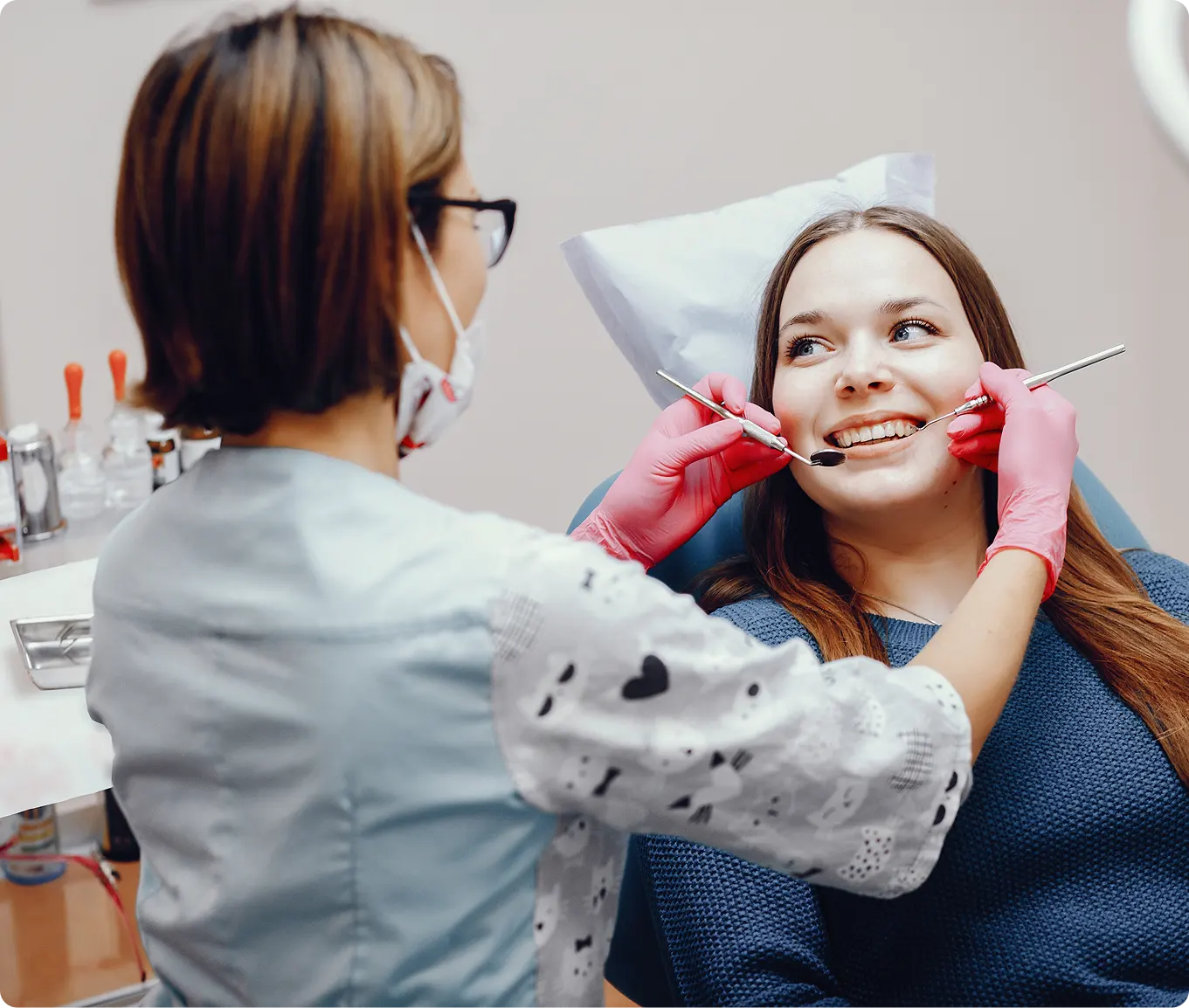 Beautiful girl sitting at dentists office